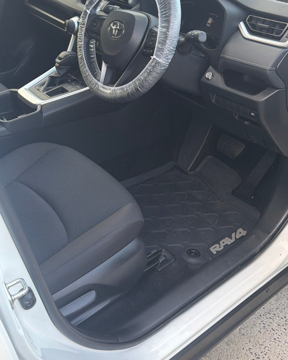 Toyota RAV4 driver's side interior, milk spill through the cabin and then fully detailed — after