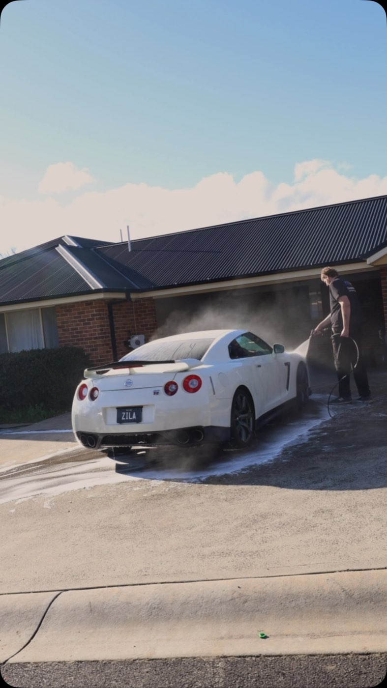 Nissan GT-R covered in snow foam during a safe contact wash